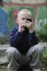 Image showing playing video games outdoor