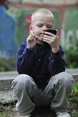 Image showing playing video games outdoor