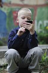 Image showing playing video games outdoor