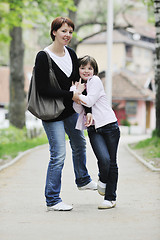 Image showing happy girl and mom outdoor