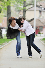 Image showing happy girl and mom outdoor