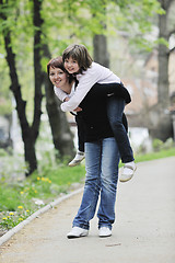 Image showing happy girl and mom outdoor