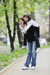 Image showing happy girl and mom outdoor