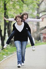 Image showing happy girl and mom outdoor