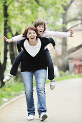 Image showing happy girl and mom outdoor