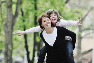 Image showing happy girl and mom outdoor