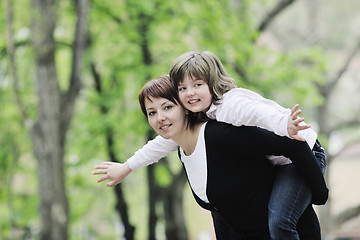 Image showing happy girl and mom outdoor