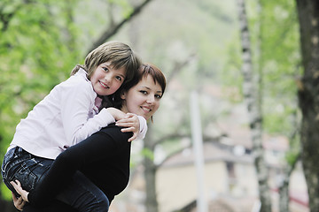 Image showing happy girl and mom outdoor