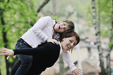 Image showing happy girl and mom outdoor