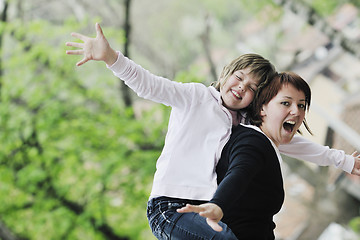 Image showing happy girl and mom outdoor