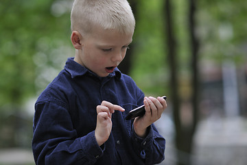 Image showing playing video games outdoor