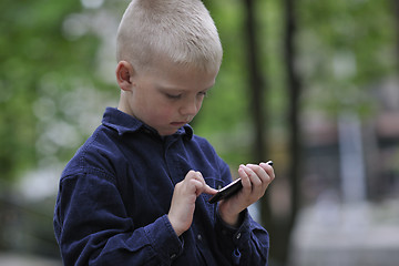 Image showing playing video games outdoor