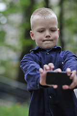 Image showing playing video games outdoor