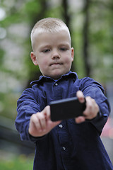 Image showing playing video games outdoor