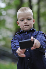 Image showing playing video games outdoor