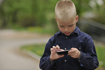 Image showing playing video games outdoor