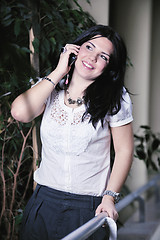 Image showing young happy business woman talking by cellphone