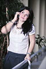 Image showing young happy business woman talking by cellphone