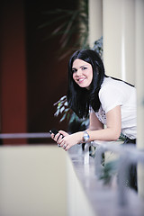 Image showing young happy business woman talking by cellphone