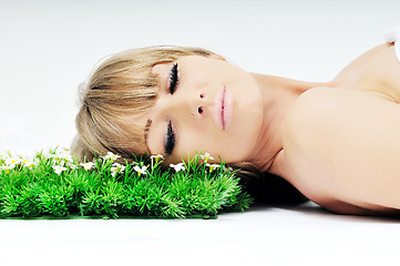 Image showing woman face on grass 