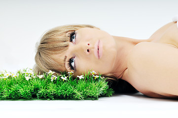 Image showing woman face on grass 