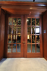 Image showing big wooden door in restaurant