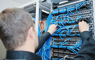 Image showing young it engeneer in datacenter server room