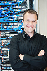 Image showing young it engeneer in datacenter server room