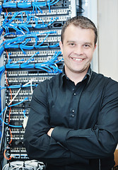 Image showing young it engeneer in datacenter server room