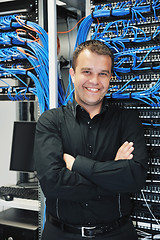 Image showing young it engeneer in datacenter server room