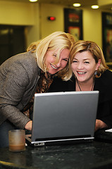 Image showing happy mature woman work on laptop