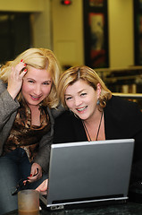 Image showing happy mature woman work on laptop