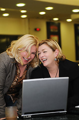 Image showing happy mature woman work on laptop