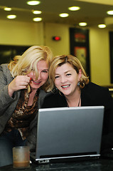 Image showing happy mature woman work on laptop