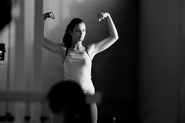 Image showing young woman with strong arms