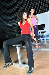 Image showing two women work out   in fitness club