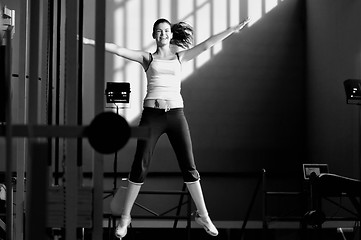 Image showing one young happy  woman jump