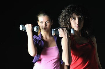 Image showing two women work out  in fitness club