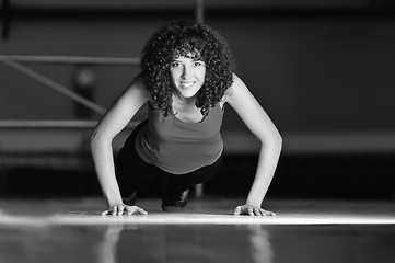 Image showing young woman practicing fitness and working out