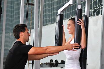 Image showing woman in fittness club with trainer