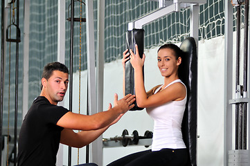 Image showing woman in fittness club with trainer