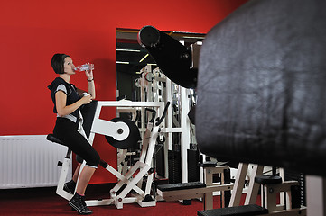 Image showing Young woman doing fitness in gym