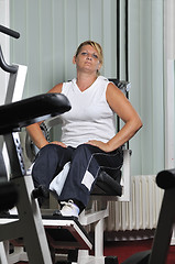 Image showing Mature  woman work out in fitness