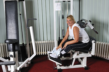 Image showing Mature  woman work out in fitness