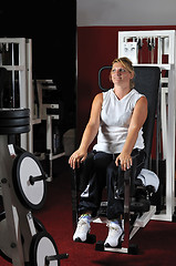 Image showing Mature  woman work out in fitness