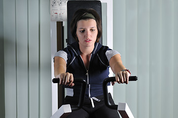 Image showing young  woman work out in fitness