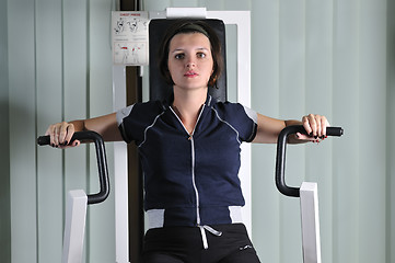 Image showing young  woman work out in fitness