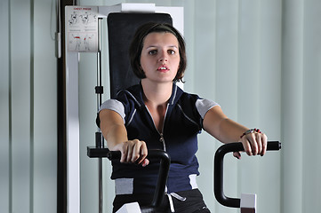 Image showing young  woman work out in fitness
