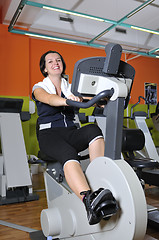 Image showing Young woman working out in gym