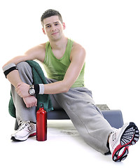 Image showing sportsman relaxing and drinking water